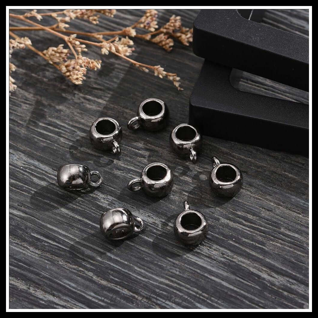 Tibetische bail beads – barrel / 11.5x8x5.5 mm / 16 stück, aus legierung / tibetisch, barrel, cadmiumfrei, nickelfrei, bleifrei in der farbe gunmetal und größe 11.5x8x5.5 mm, innendurchmesser: 4.8 mm, loch: 2 mm / 16 st.