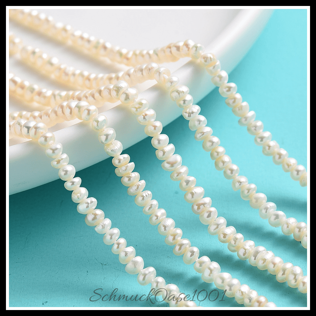 Kultivierte süßwasserperlen stränge – creme-weiß, 2–4 mm (1 strang), aus natürliche süßwasserperlen / zwei seiten poliert in der farbe creme-weiß und größe 2–3 mm, bohrung: 0.8 mm, ca. 190–200 stk./strang